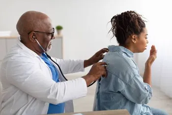 doctor checking the chest of a patient with a stethoscope